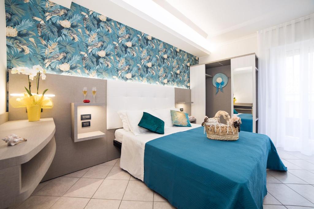 Viva Beach Hotel tesisinde bir odada yatak veya yataklar