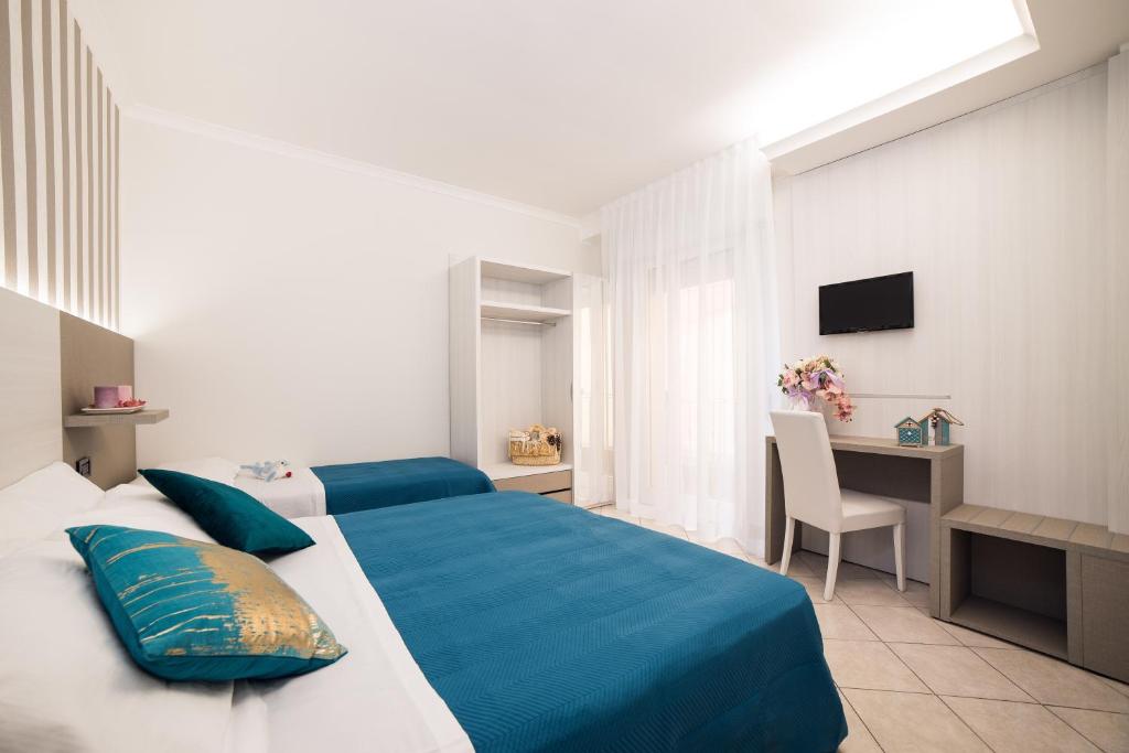Postel nebo postele na pokoji v ubytování Viva Beach Hotel