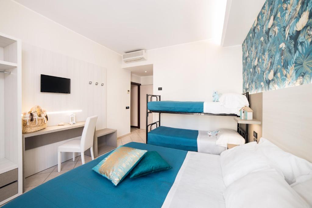 Postel nebo postele na pokoji v ubytování Viva Beach Hotel
