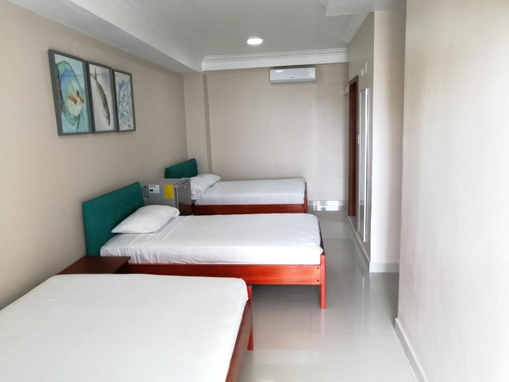 Postel nebo postele na pokoji v ubytování Hotel Andy