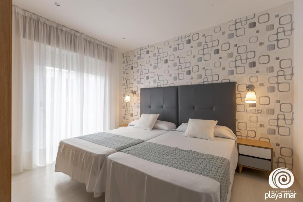 Postel nebo postele na pokoji v ubytování Apartamentos Turísticos Playa Mar I