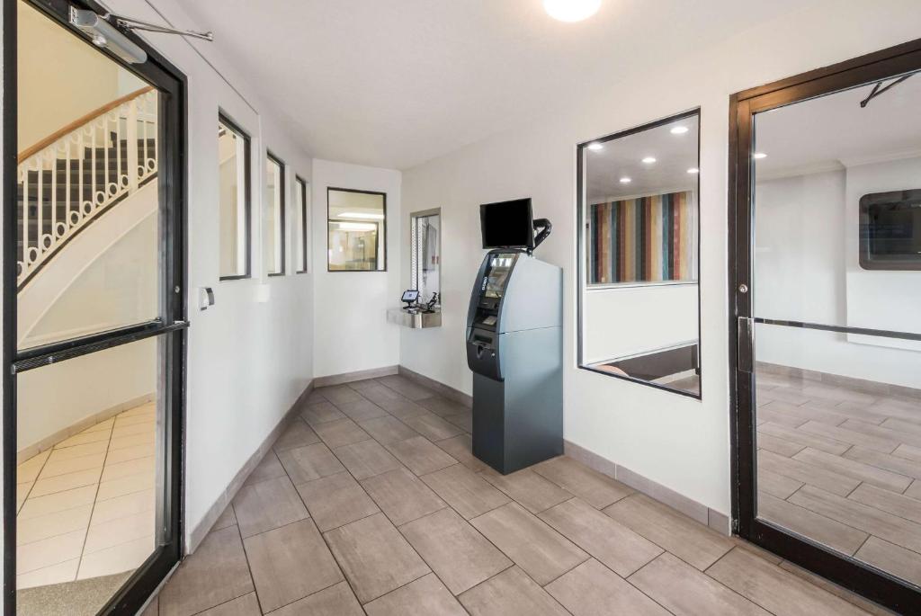 a hallway with a refrigerator and a staircase at Studio 6 Laredo, Tx - North I-35 in Laredo