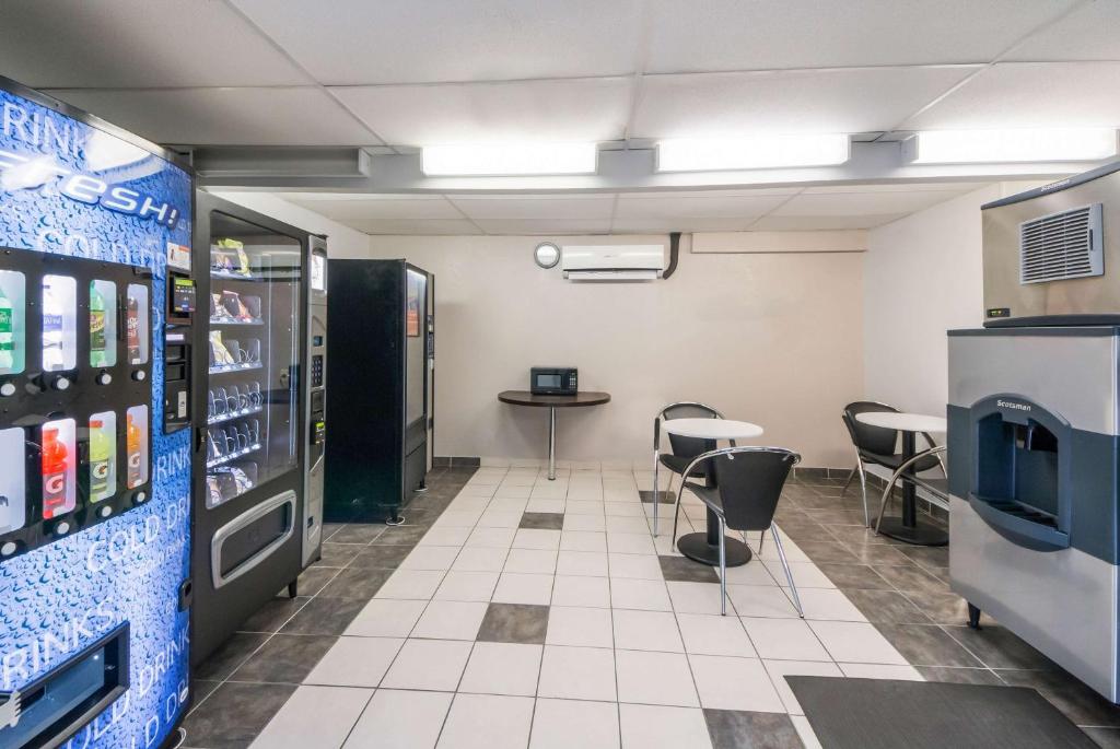 a room with tables and chairs and vending machines at Studio 6 Laredo, Tx - North I-35 in Laredo