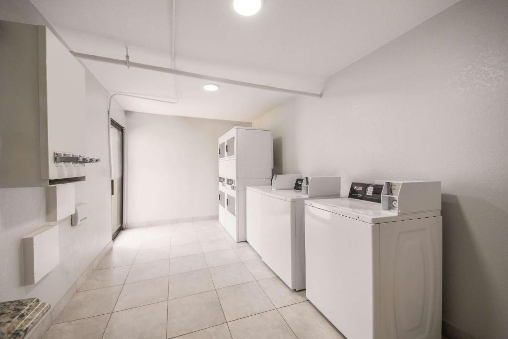 a hallway with white appliances in a room at Studio 6 Laredo, Tx - North I-35 in Laredo