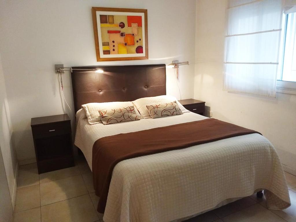 Кровать или кровати в номере Departamento 2 ambientes en Palermo - para 4 personas
