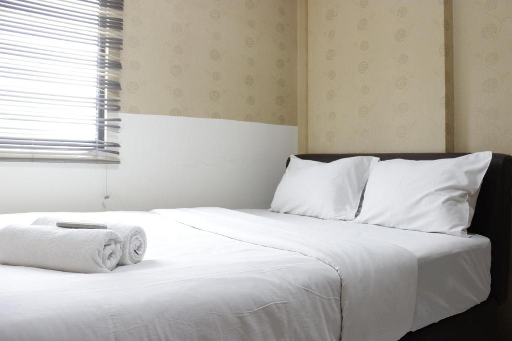 Strategic & Relaxing 2BR at Gateway Apartment Ahmad Yani Cicadas By Travelio Images