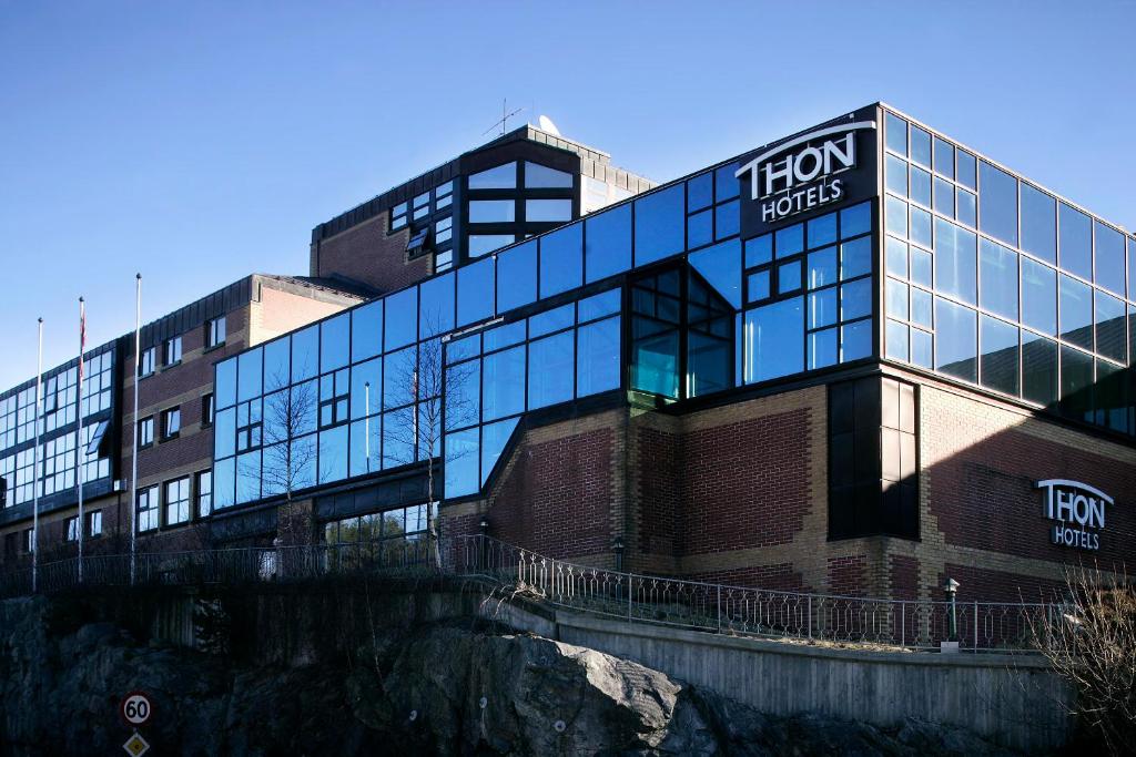 a building with a sign on the side of it at Thon Hotel Bergen Airport in Bergen
