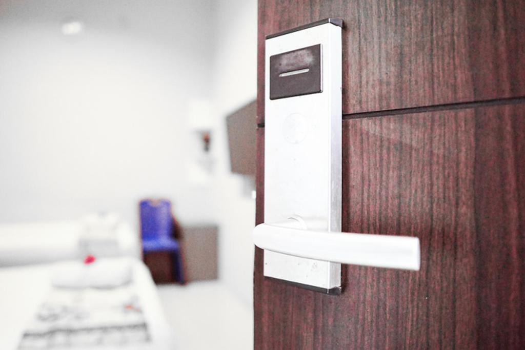 Postel nebo postele na pokoji v ubytování Audah Syariah Residence Mitra RedDoorz