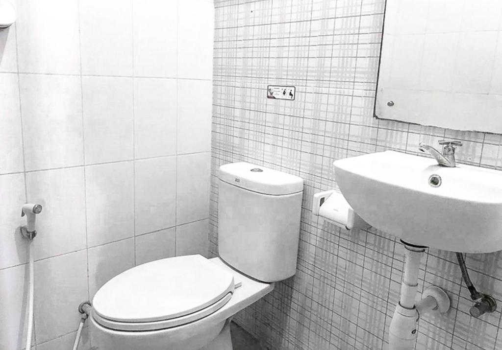 Koupelna v ubytování Audah Syariah Residence Mitra RedDoorz