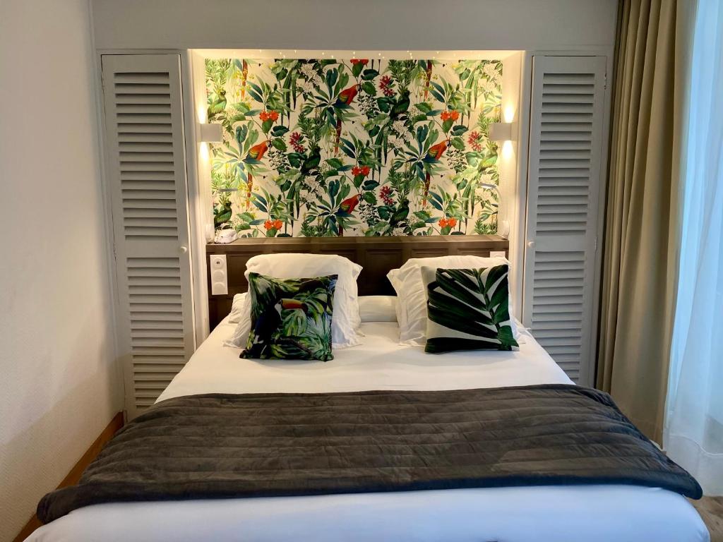 Postel nebo postele na pokoji v ubytování Hôtel Moderna