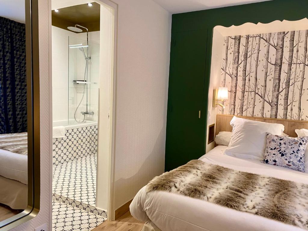 Postel nebo postele na pokoji v ubytování Hôtel Moderna