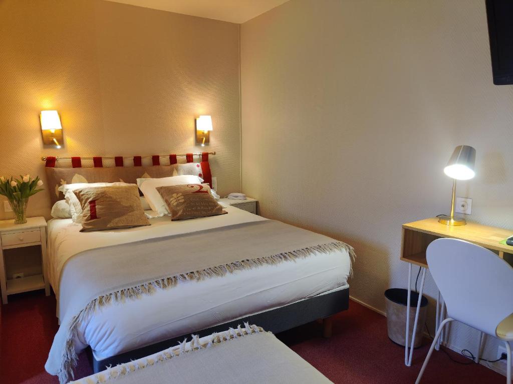 Postel nebo postele na pokoji v ubytování Hôtel Moderna