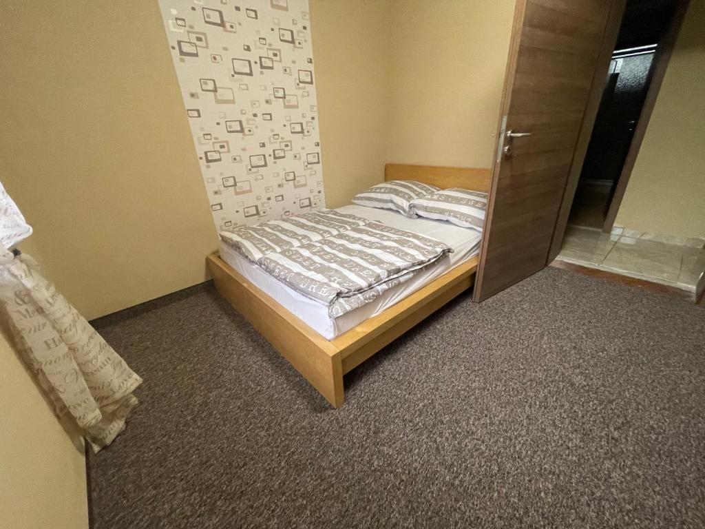 Postel nebo postele na pokoji v ubytování Grátisz Apartman Siófok