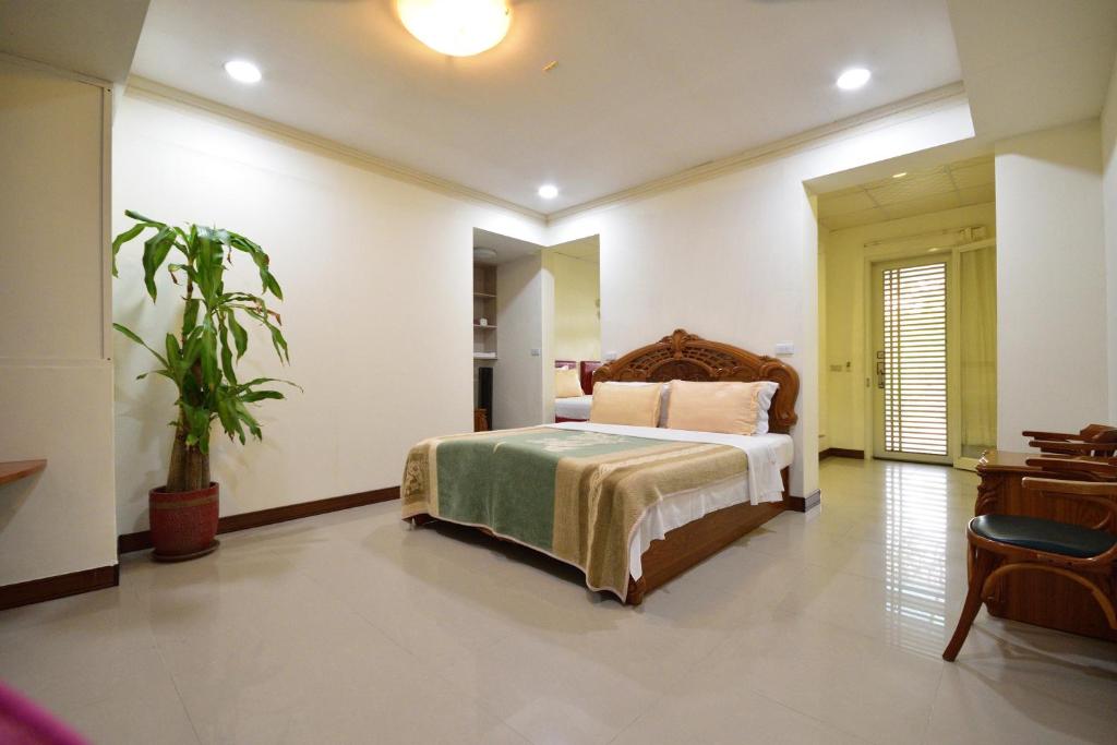 Postel nebo postele na pokoji v ubytování Taitung Linyuan B&B