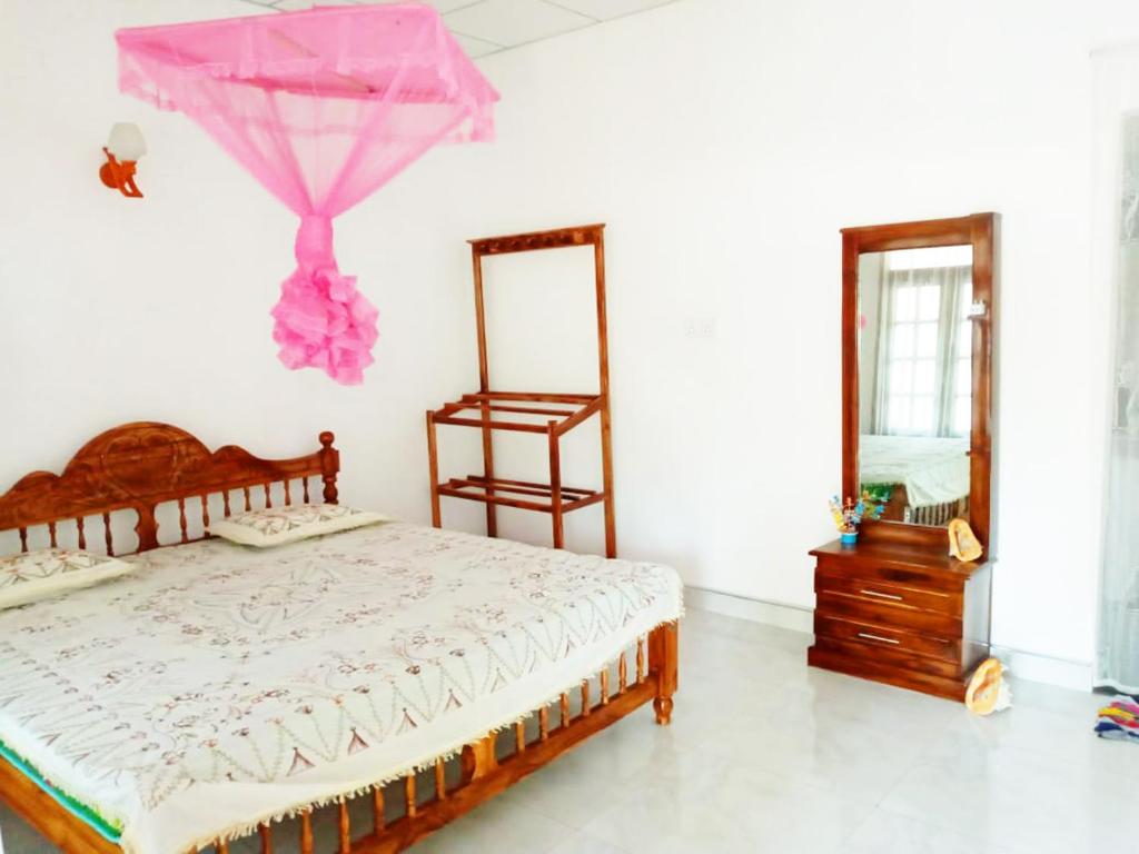 Postel nebo postele na pokoji v ubytování Sulashika Beach House