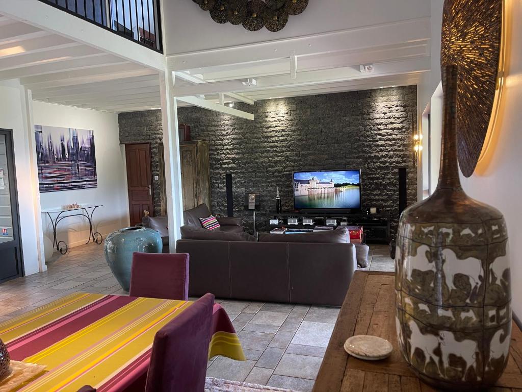 TV a/nebo společenská místnost v ubytování Villa Maido Luxe