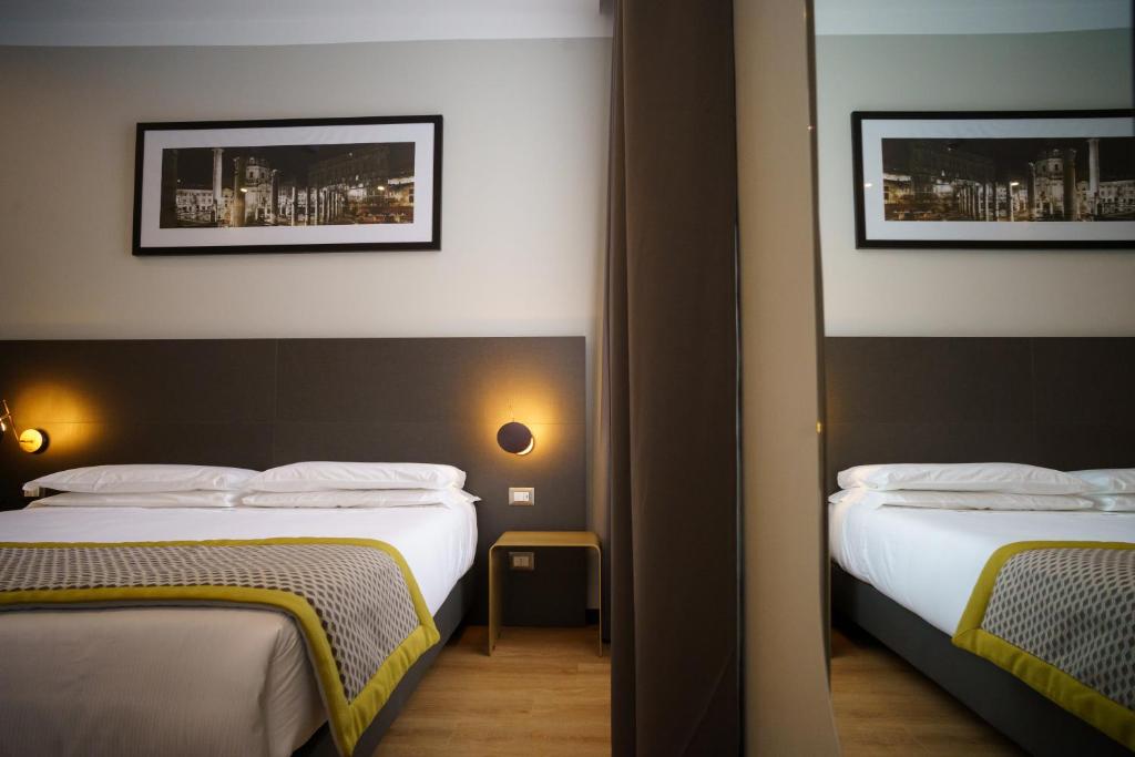 Postel nebo postele na pokoji v ubytování The Cross Hotel