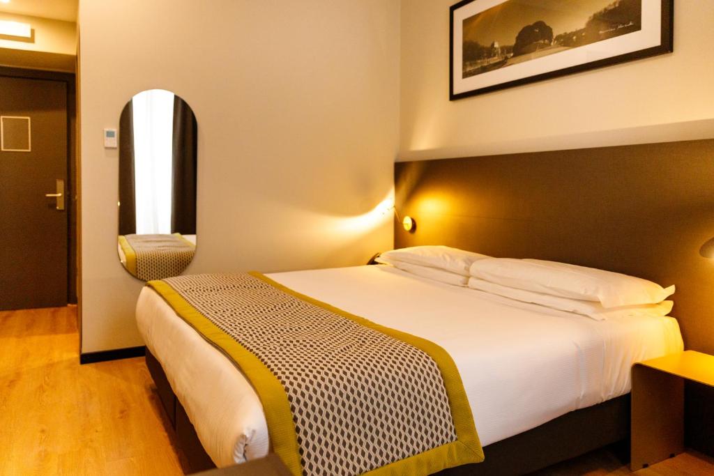 Postel nebo postele na pokoji v ubytování The Cross Hotel