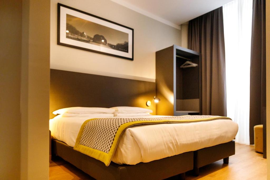 Postel nebo postele na pokoji v ubytování The Cross Hotel