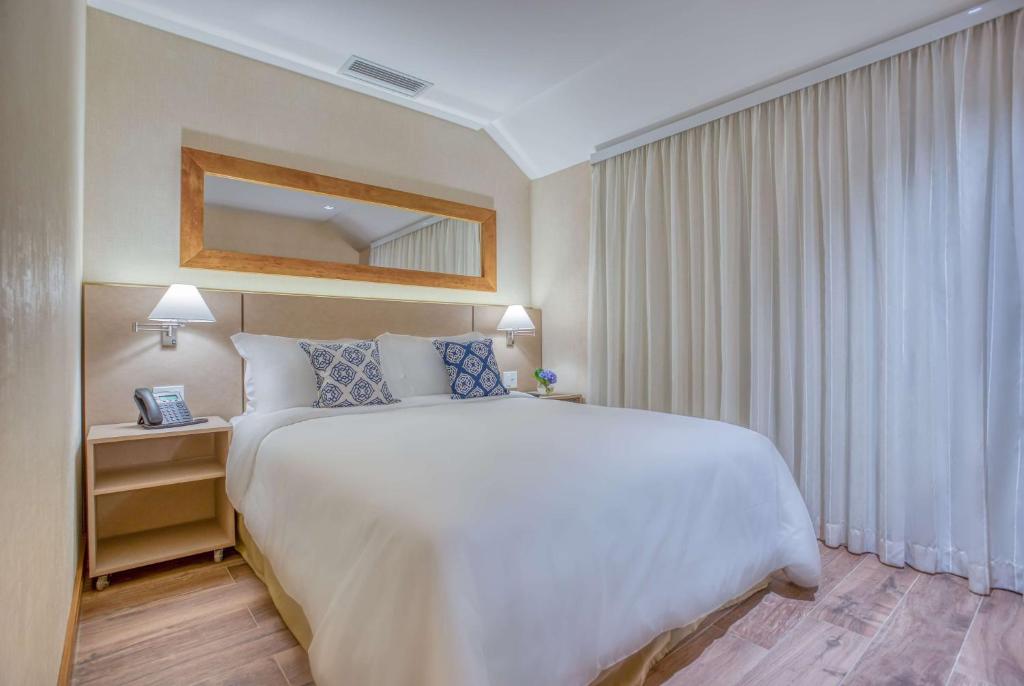 Postel nebo postele na pokoji v ubytování Wyndham Gramado Termas Resort & Spa