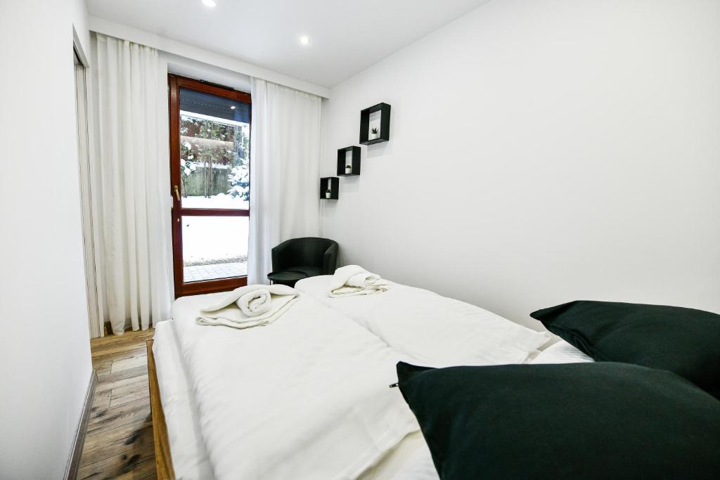 Posteľ alebo postele v izbe v ubytovaní RentPlanet - Apartamenty Bulwary Słowackiego
