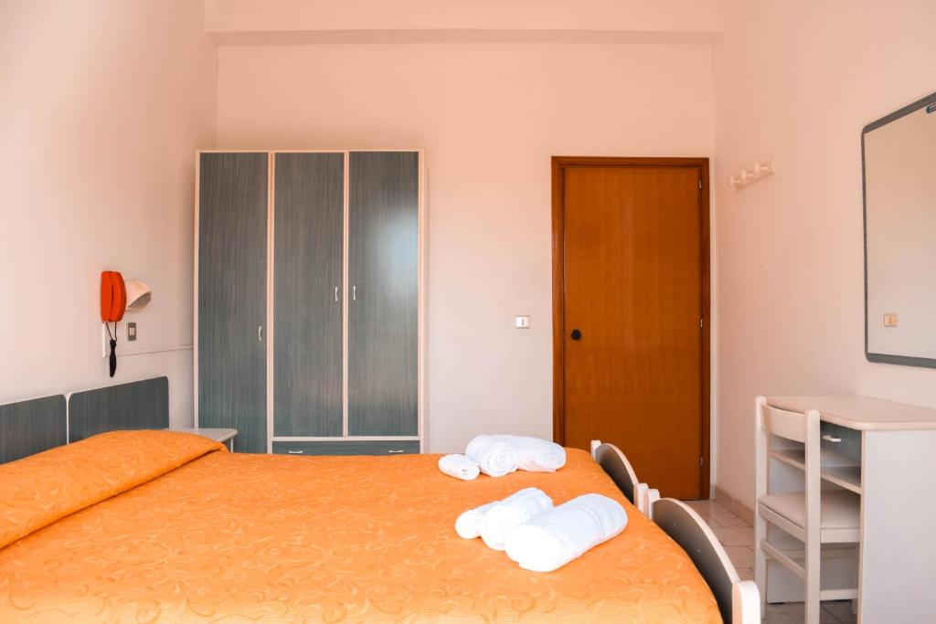 Postel nebo postele na pokoji v ubytování Hotel Zeus
