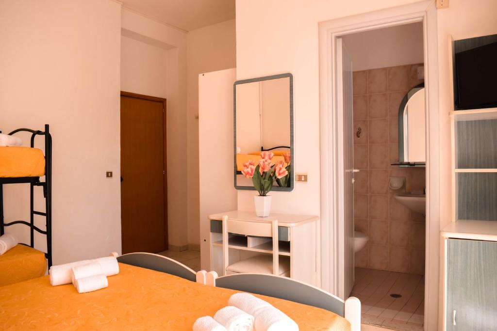 Postel nebo postele na pokoji v ubytování Hotel Zeus