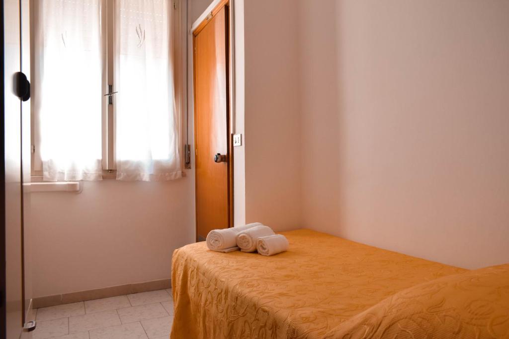 Postel nebo postele na pokoji v ubytování Hotel Zeus