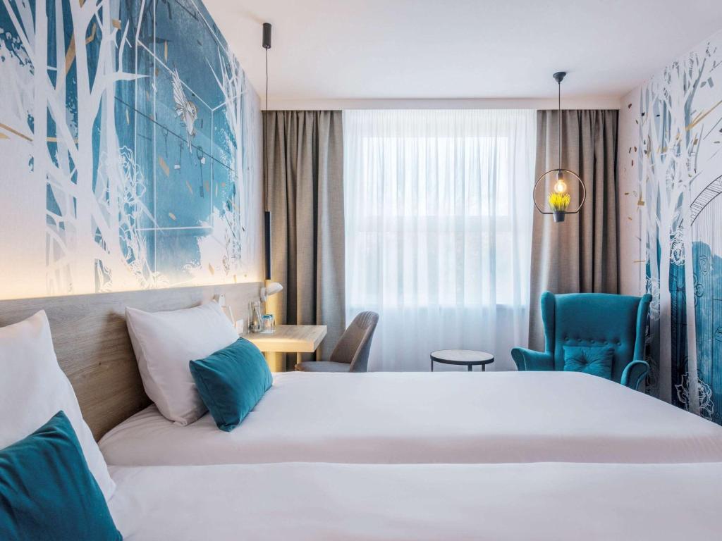 Postel nebo postele na pokoji v ubytování ibis Styles Kraków East
