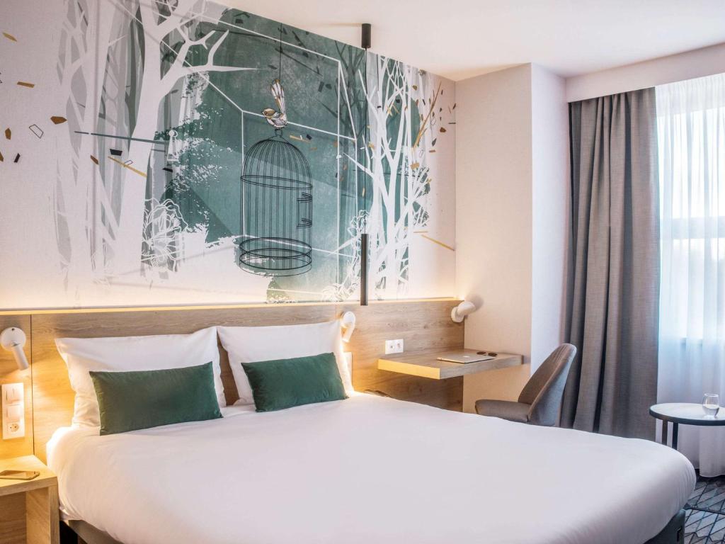 Postel nebo postele na pokoji v ubytování ibis Styles Kraków East