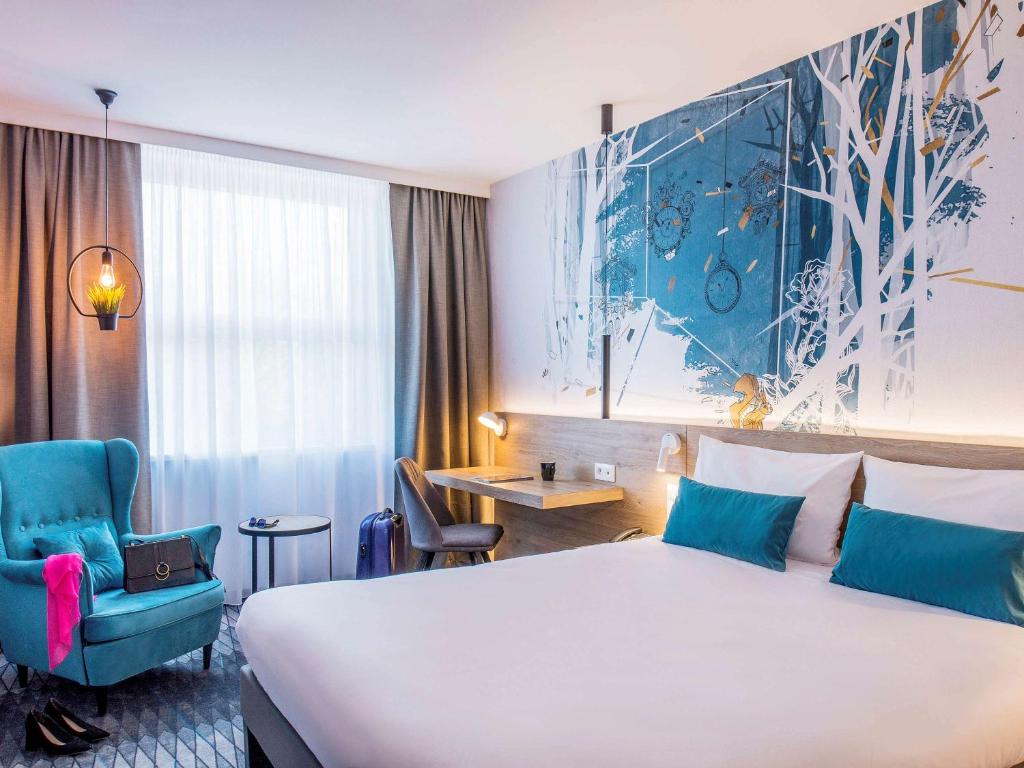 Postel nebo postele na pokoji v ubytování ibis Styles Kraków East