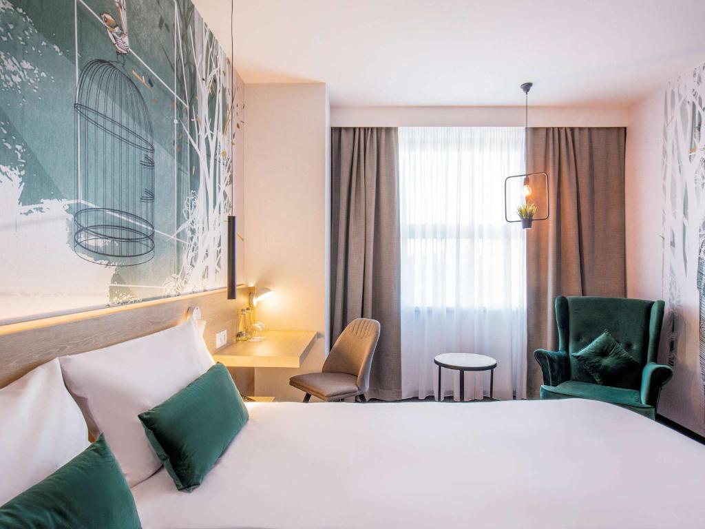 Postel nebo postele na pokoji v ubytování ibis Styles Kraków East