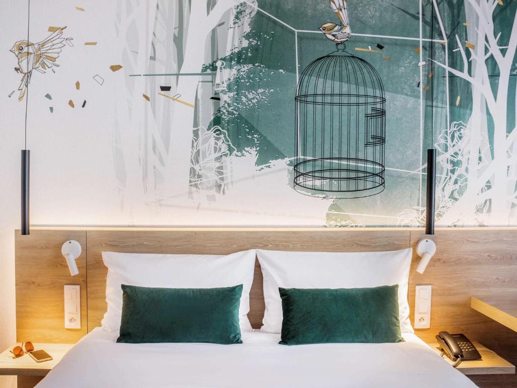 Postel nebo postele na pokoji v ubytování ibis Styles Kraków East