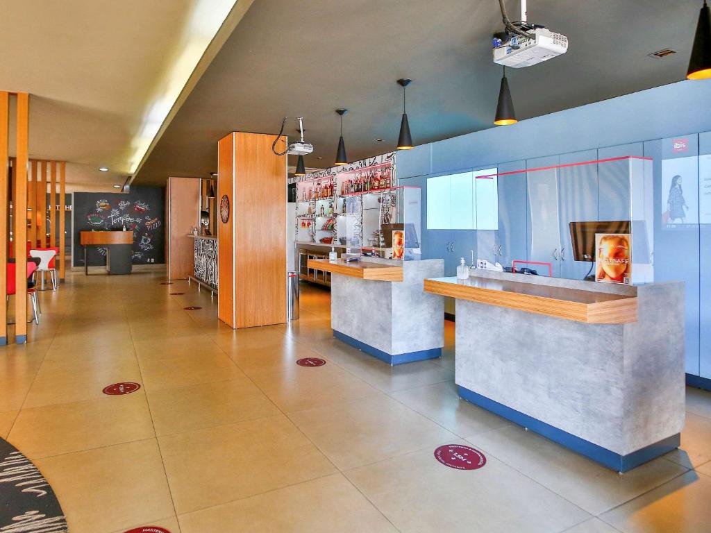 a large kitchen with a lot of counter space at ibis Goiania in Goiânia