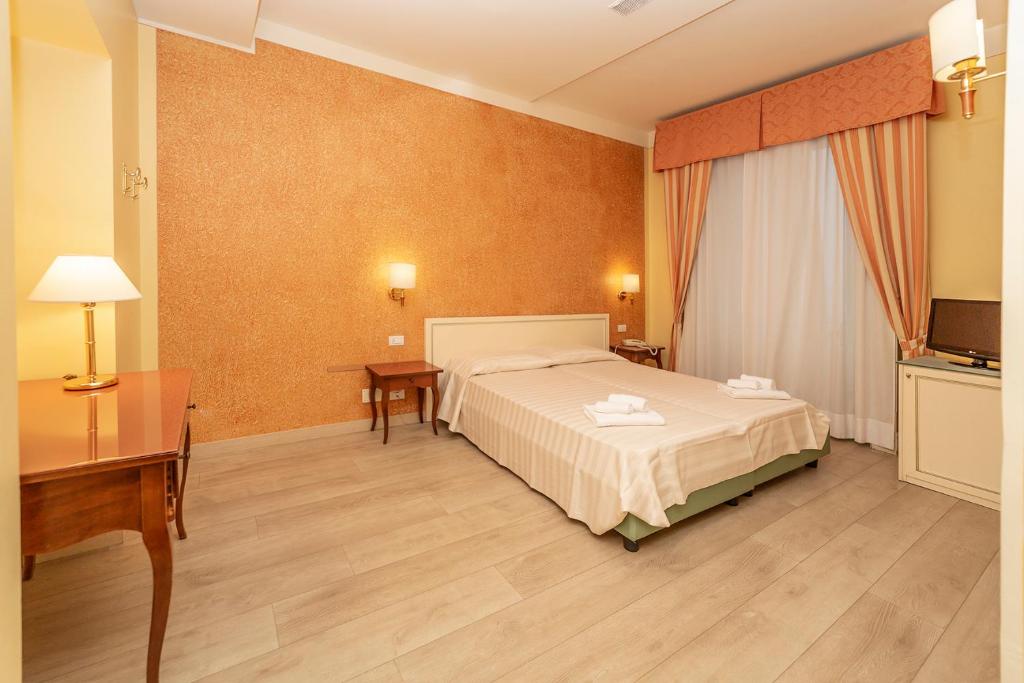 Postel nebo postele na pokoji v ubytování Hotel Pallanza by LVG Hotel Collection