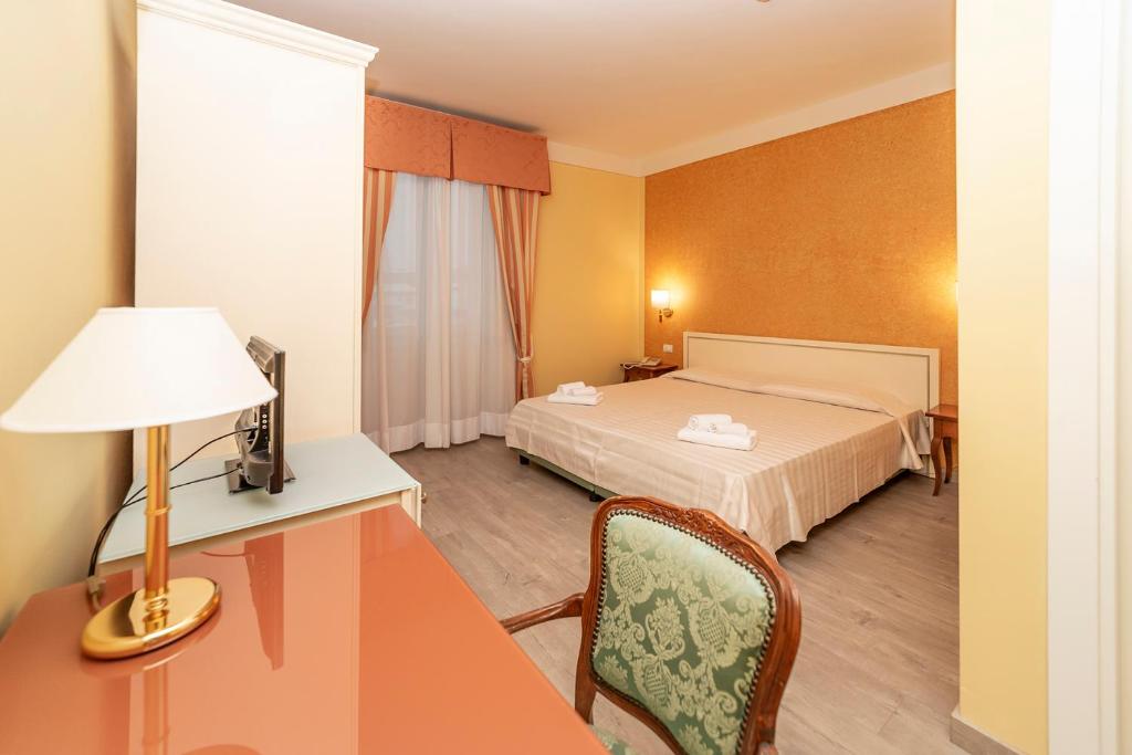 Postel nebo postele na pokoji v ubytování Hotel Pallanza by LVG Hotel Collection