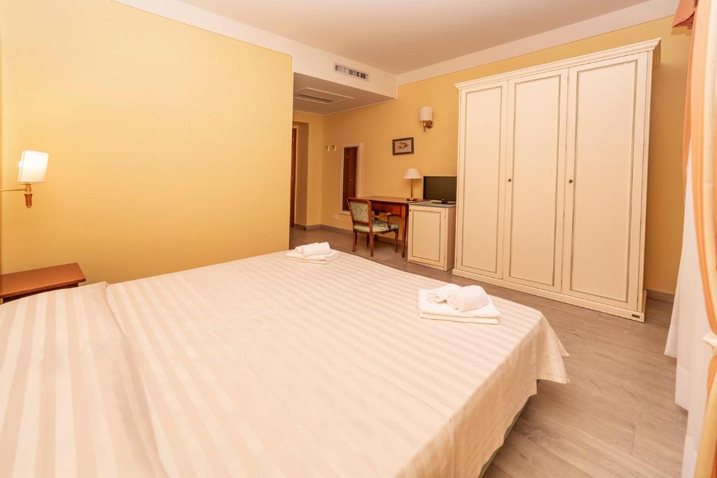 Postel nebo postele na pokoji v ubytování Hotel Pallanza by LVG Hotel Collection