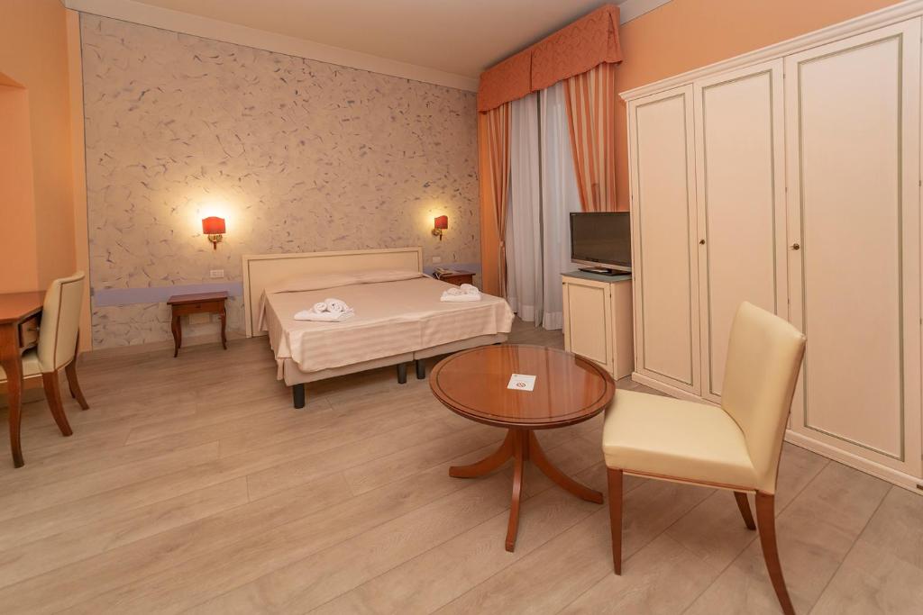 Postel nebo postele na pokoji v ubytování Hotel Pallanza by LVG Hotel Collection