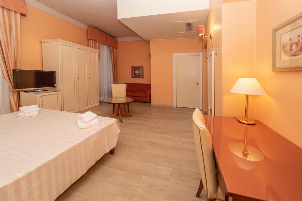 Postel nebo postele na pokoji v ubytování Hotel Pallanza by LVG Hotel Collection