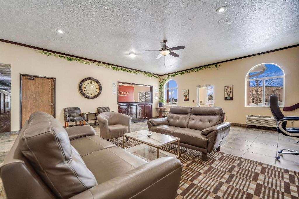 a living room with a couch and a table at Quality Inn in Hastings