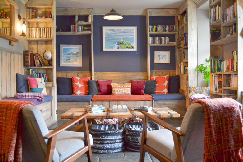 a living room with a couch and a table at The Rocks at Plas Curig Hostel in Capel Curig