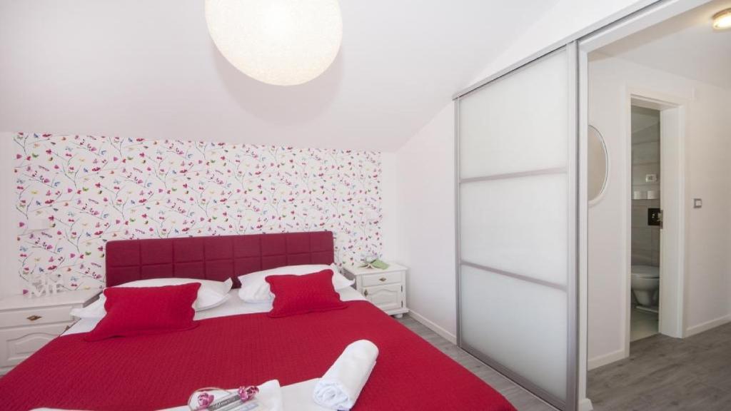 Postel nebo postele na pokoji v ubytování Apartments Angela