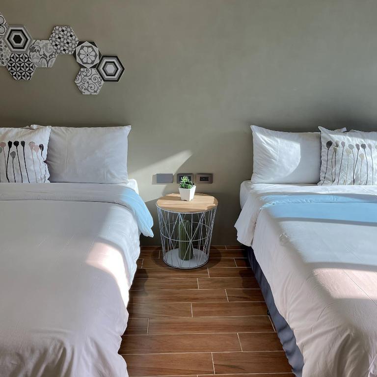 Postel nebo postele na pokoji v ubytování Sundaze