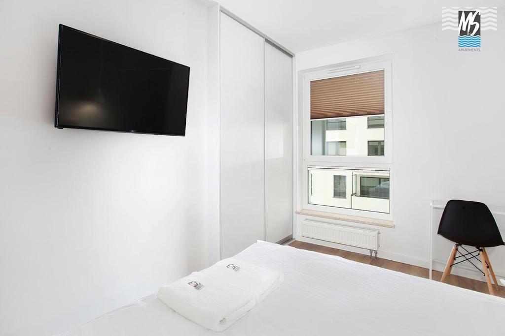 Televízia a/alebo spoločenská miestnosť v ubytovaní MS Apartments Sky Tower VI