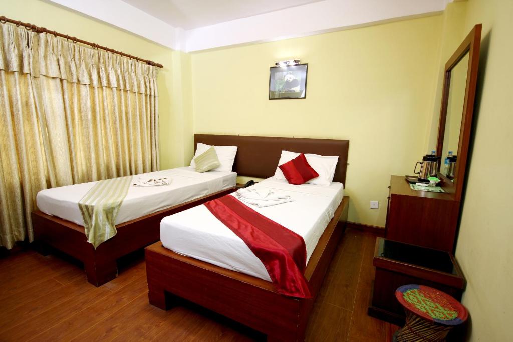 Postel nebo postele na pokoji v ubytování New Hotel Panda