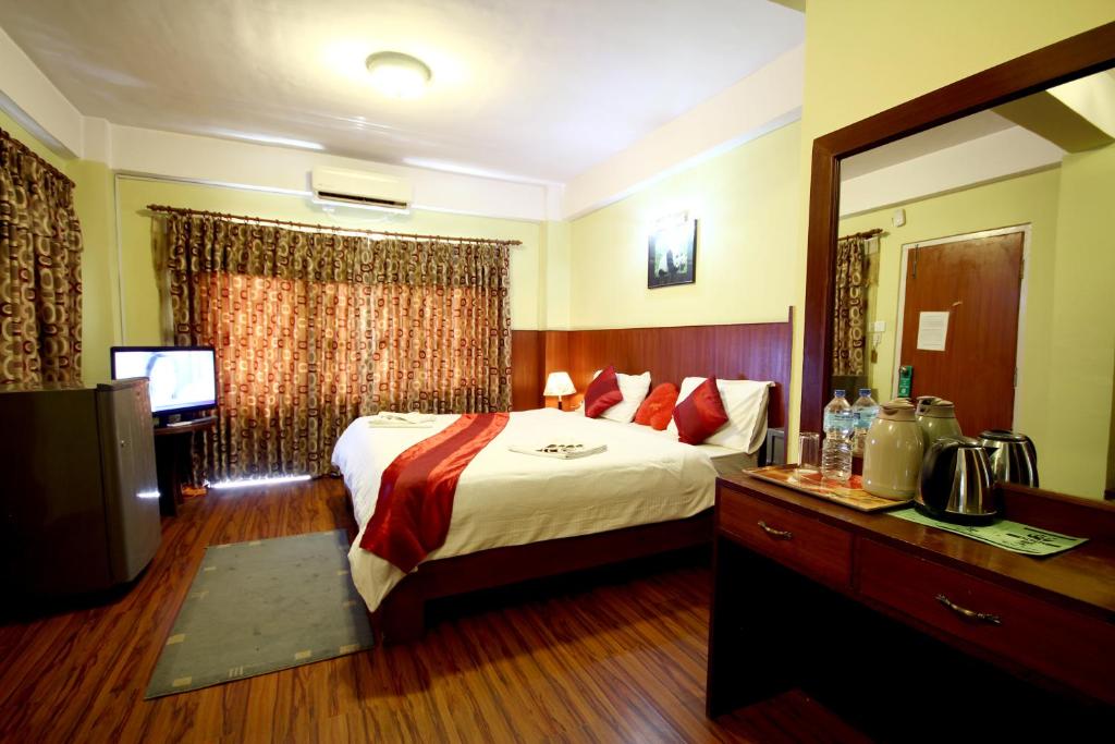 Postel nebo postele na pokoji v ubytování New Hotel Panda