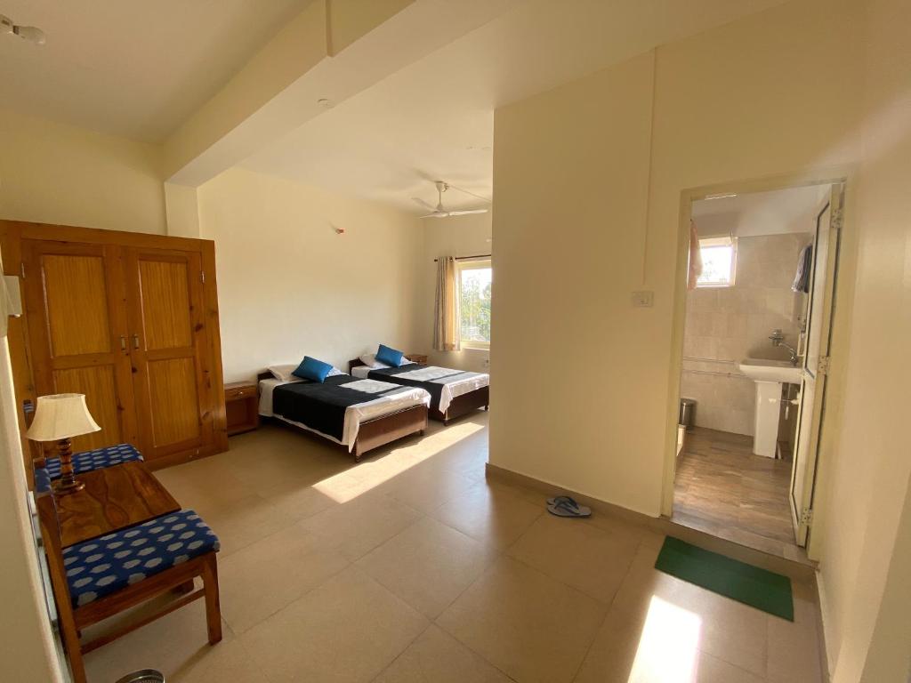 Postel nebo postele na pokoji v ubytování Zhim Zhim Guest House