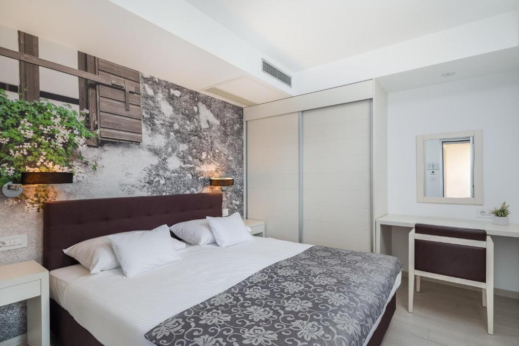 Postel nebo postele na pokoji v ubytování Hotel Tamaris