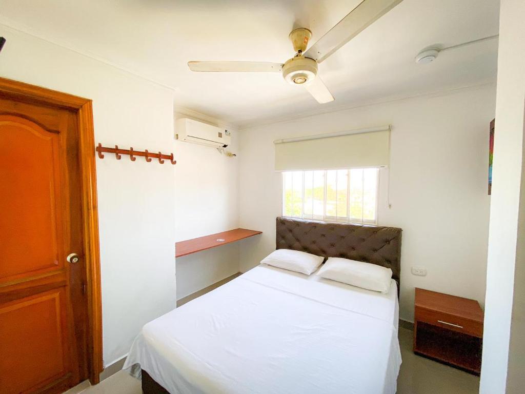 Postel nebo postele na pokoji v ubytování Hotel Aeromar Central