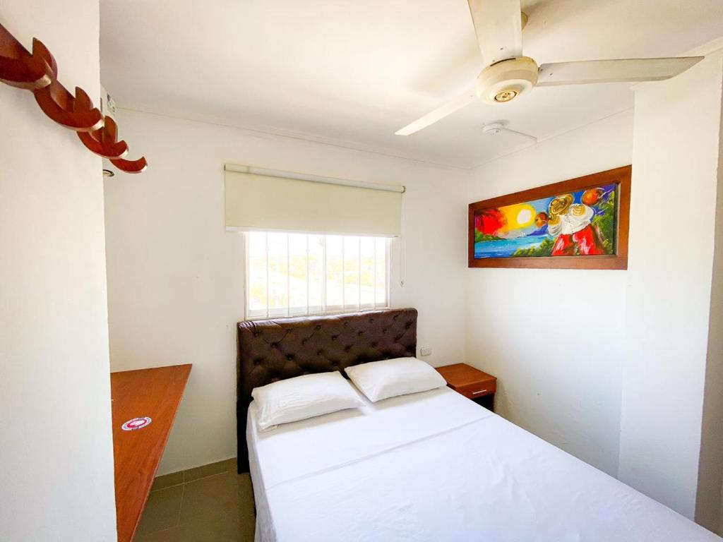 Postel nebo postele na pokoji v ubytování Hotel Aeromar Central